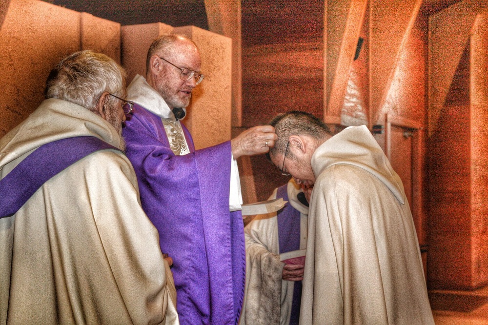 Monk being marked for repentance during lent