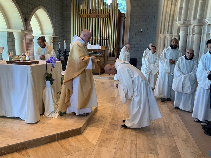 Fr. Park distributes communion of Holy Eucharist to the monks at New Clairvaux Abbey