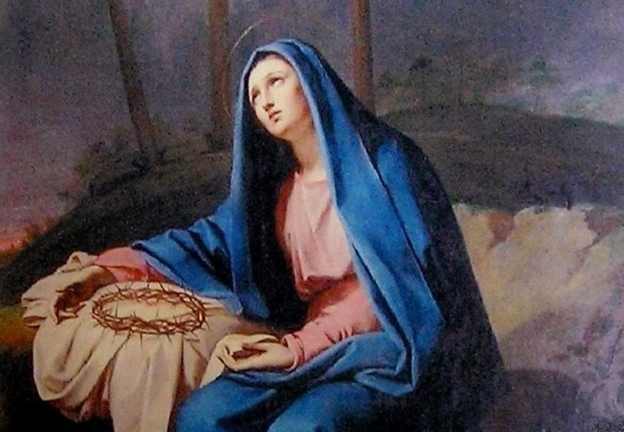 Our Sorrowful Mother at the foot of the Cross, holding the Crown of Thorns